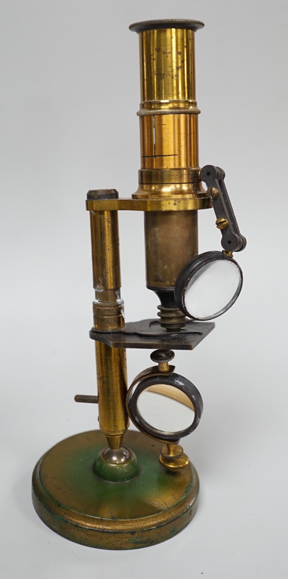 A cased brass monocular microscope